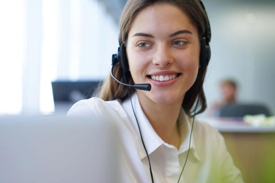 A customer service representative wearing a headset